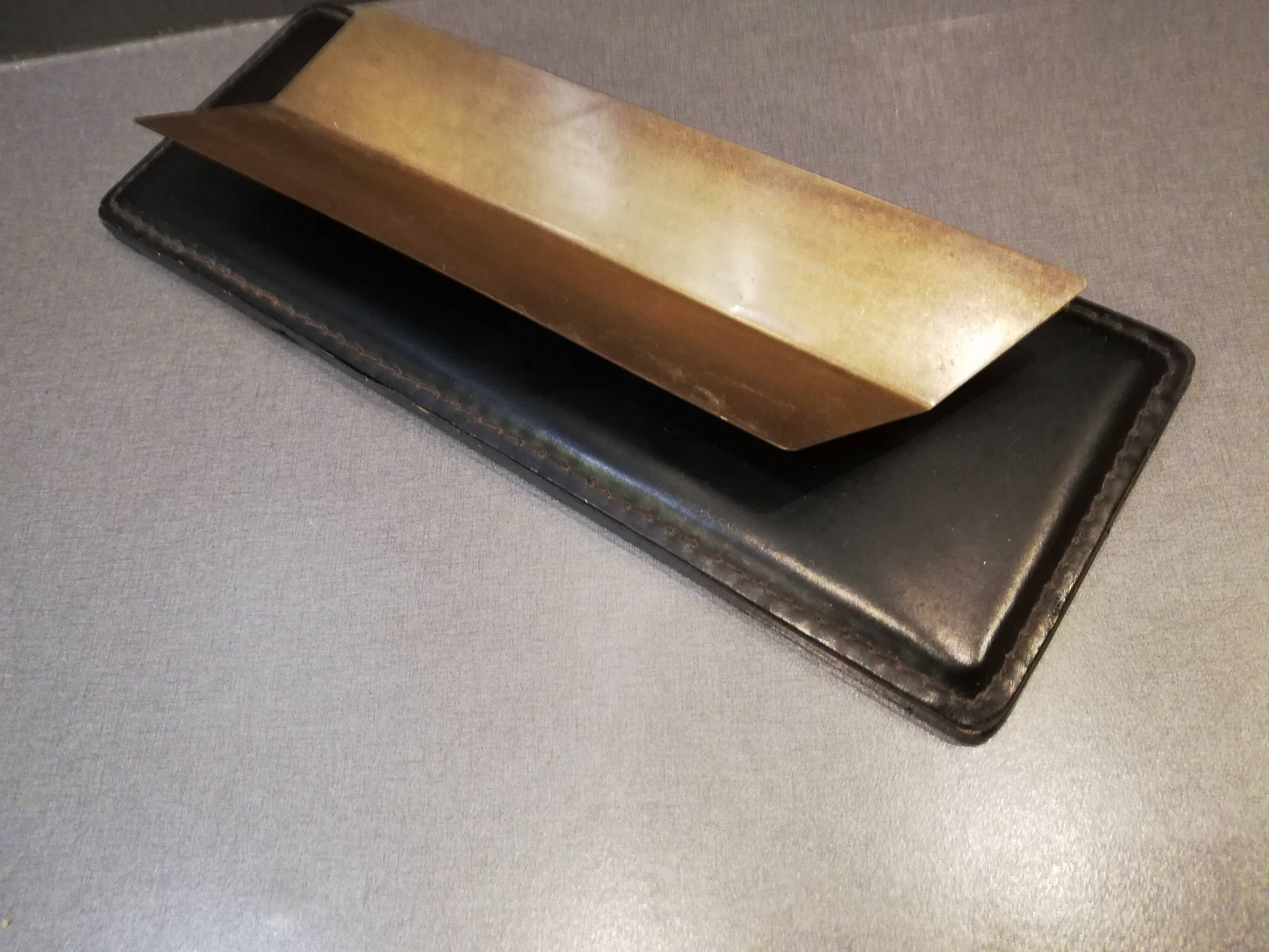 Set office stitched leather and brass wears feather pens