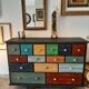 Meuble commode 15 tiroirs tableau patchwork patine ebeniste tout bois massif multicolores