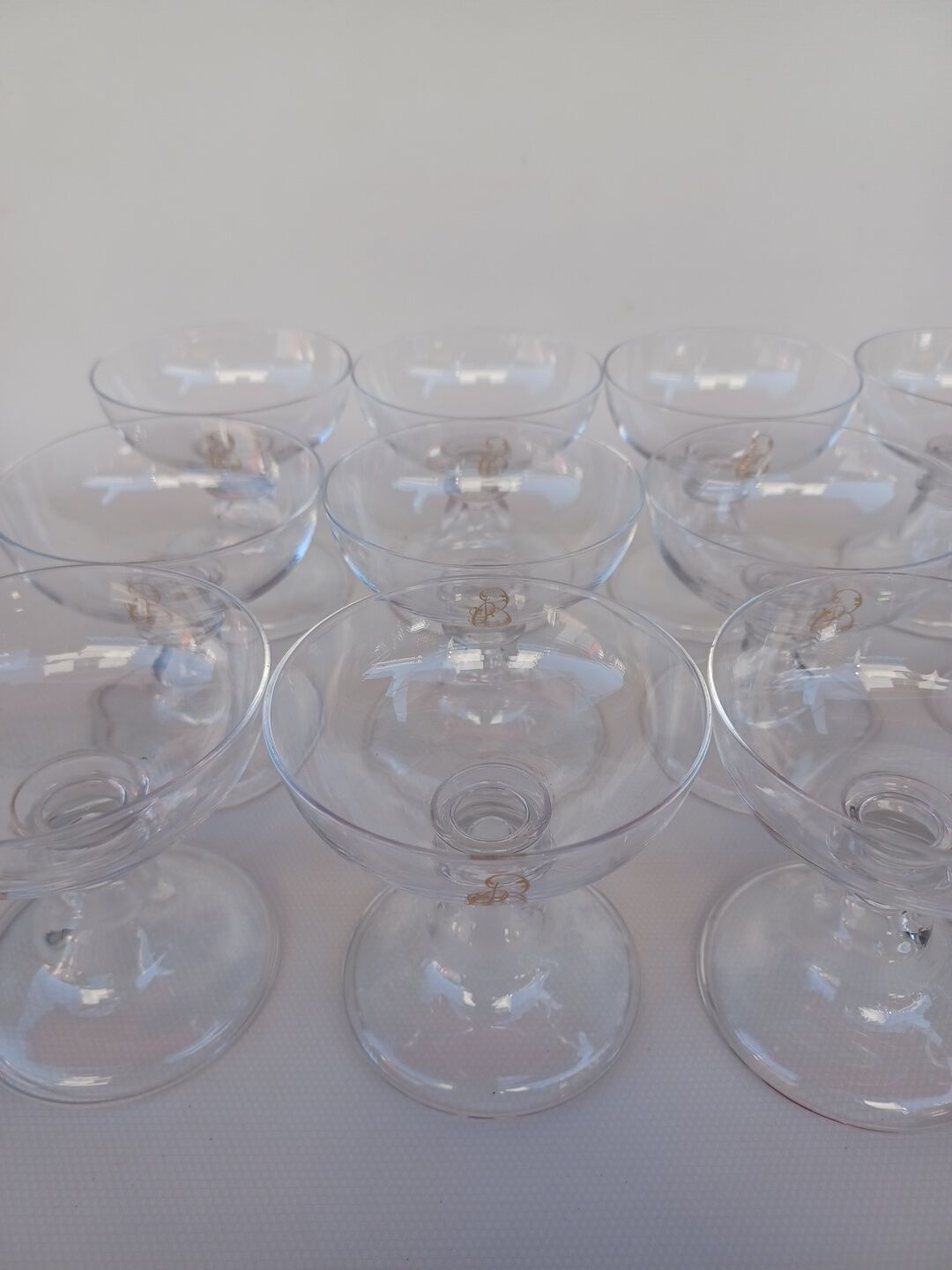 12 Val Saint Lambert crystal champagne glasses. Plain Bell Foot Service. Late 19th century.