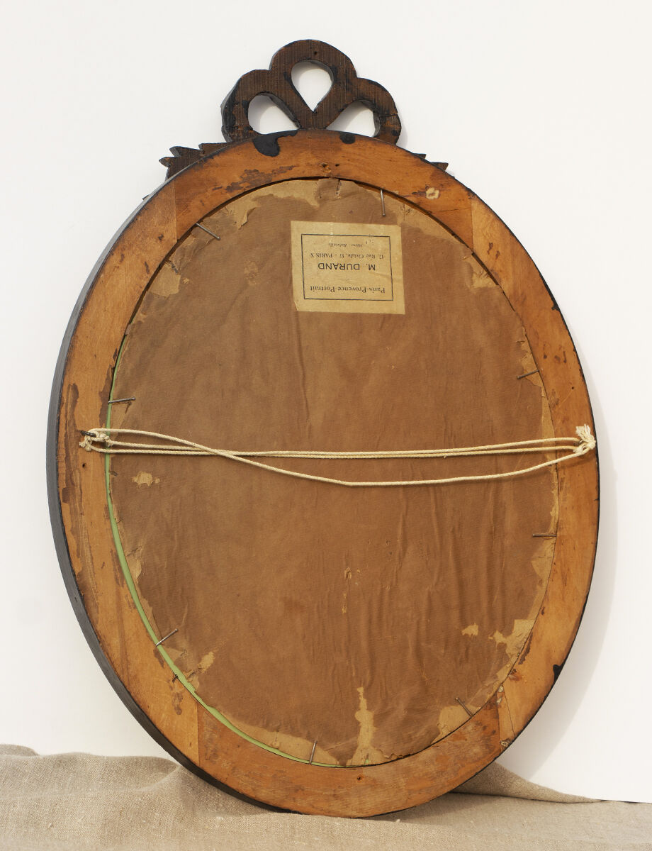 Miroir ovale au nœud rubané 112x52cm