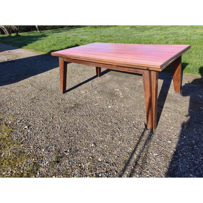 1960s oak dining table with integrated extensions.