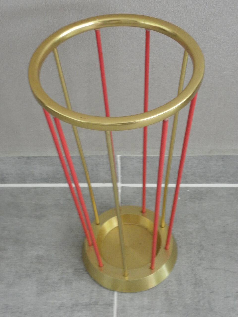 Golden and red umbrella holder