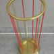 Golden and red umbrella holder