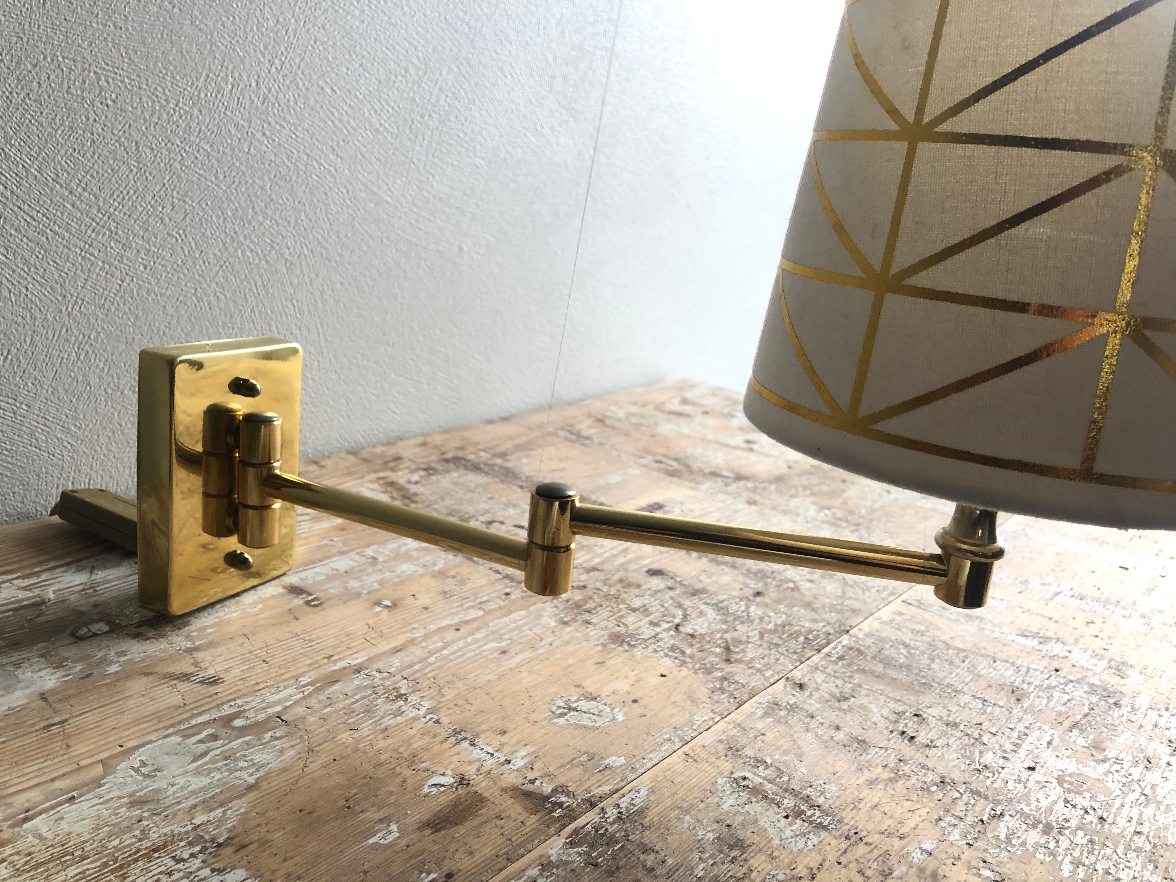 Deschuytener brass articulated wall lamp