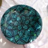 Hand-painted vintage oriental hollow dish, black patterns on a turquoise background