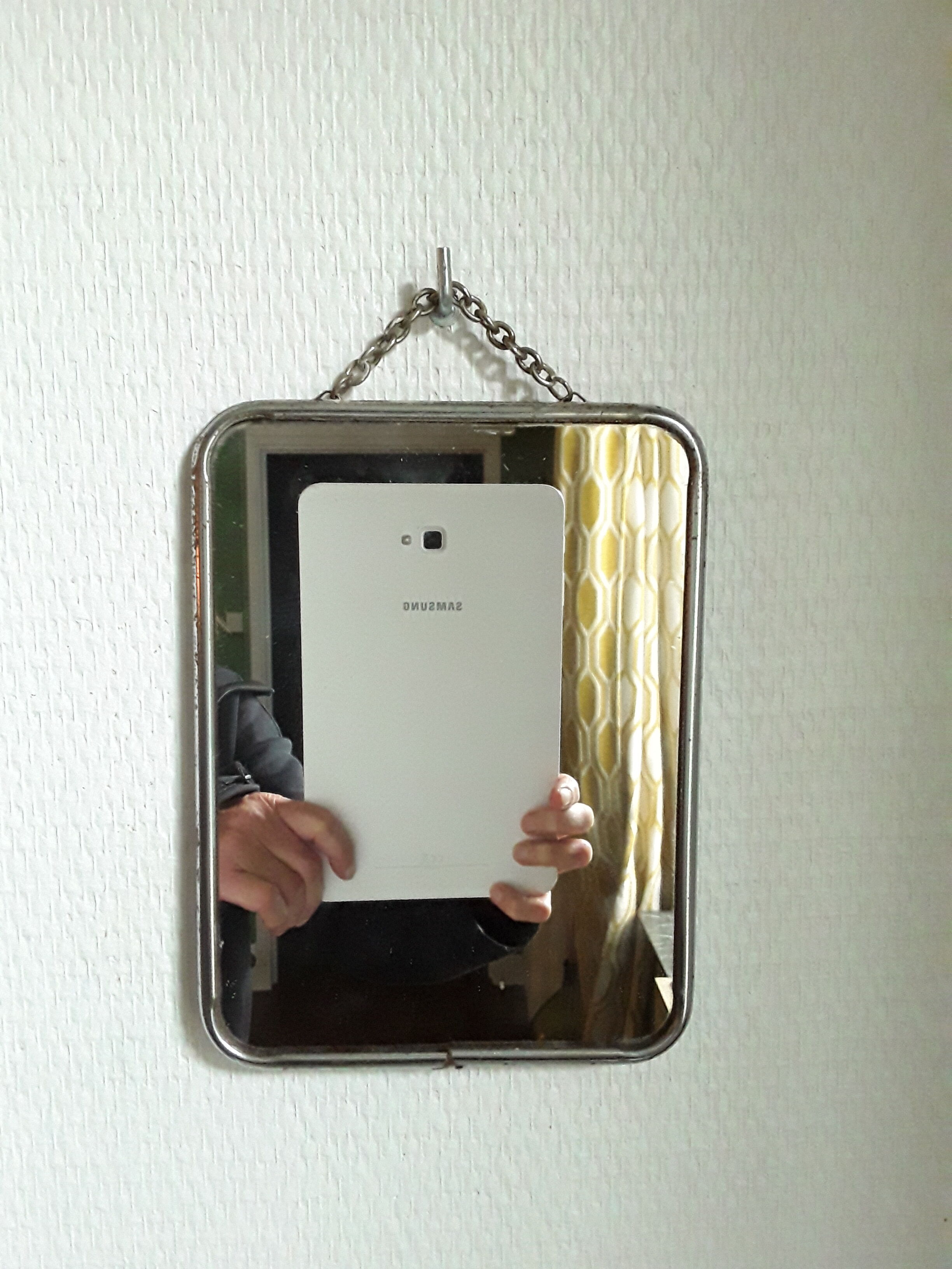 Vintage barber mirror with chain