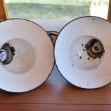 Pair of black enamelled sheet metal pendant lights from the 1950s.