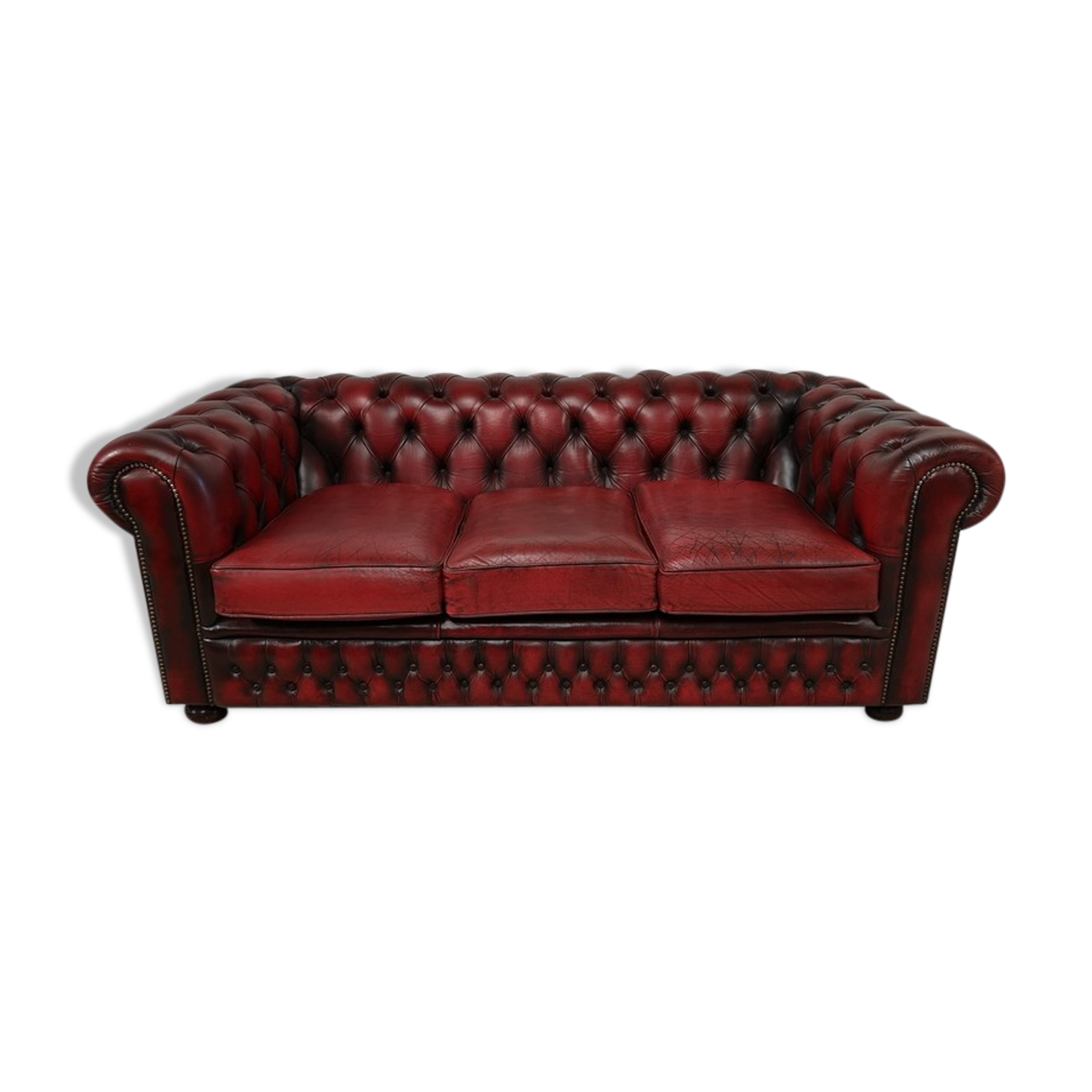 Three-seater red leather chesterfield sofa
