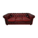 Three-seater red leather chesterfield sofa