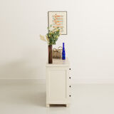 Small accent cabinet with drawers and swing doors