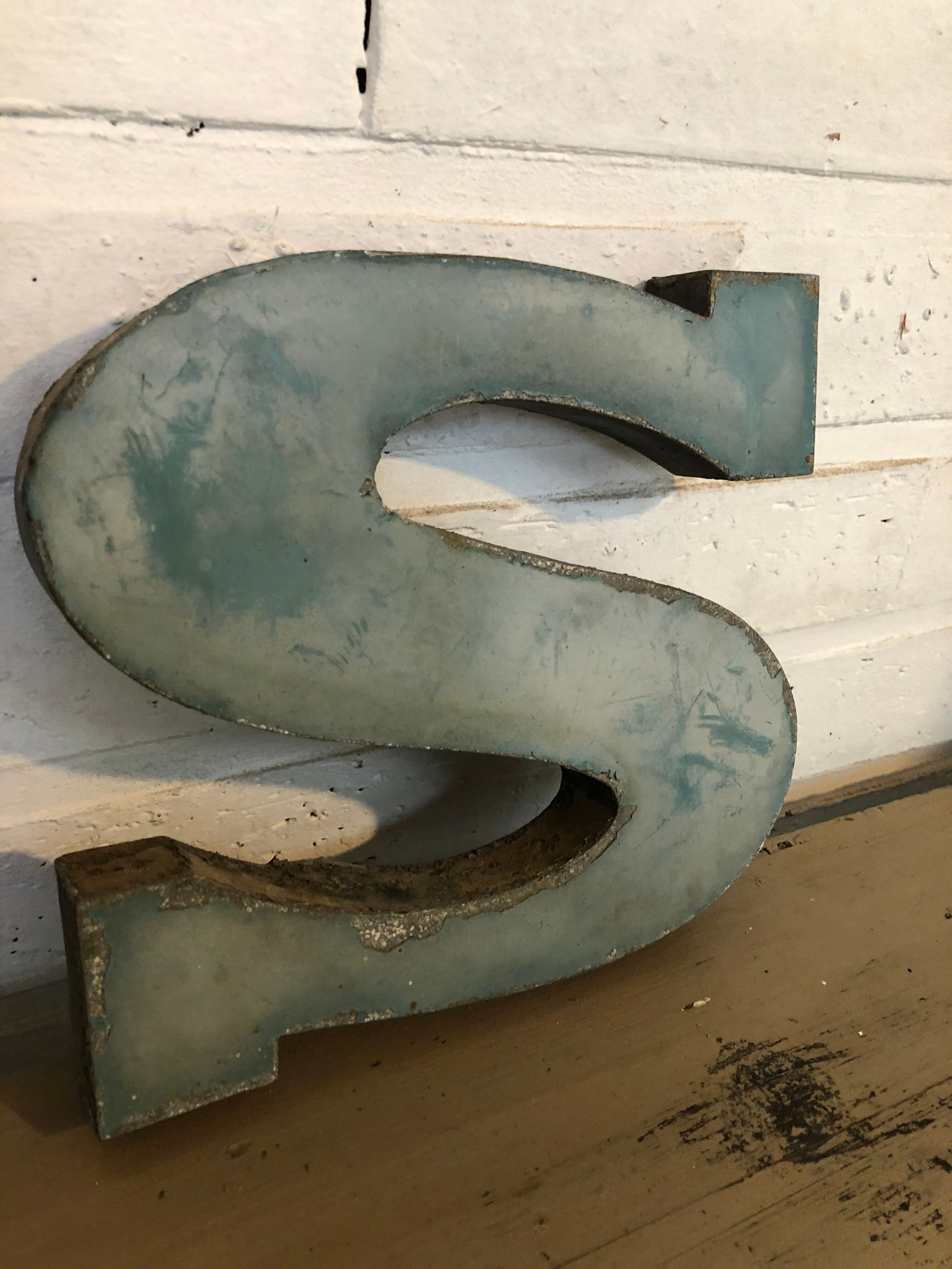 Blue sign letter "S"