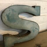 Blue sign letter "S"