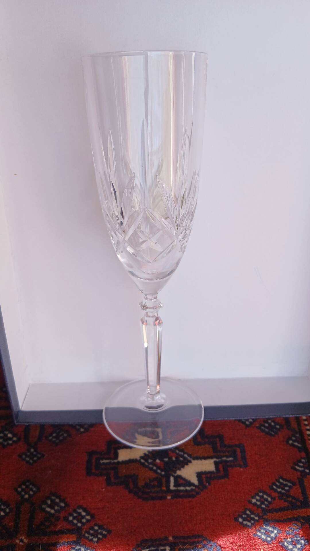6 crystal champagne flutes from Lorraine Walsheid in their case.