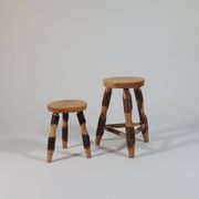 Pair of walnut stools sculpted in a vintage mid-century cross-section.