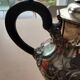 Teapot and sugar bowl in silver-plated metal.