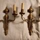 Pair of Louis XVI style neoclassical wall sconces in gilt bronze