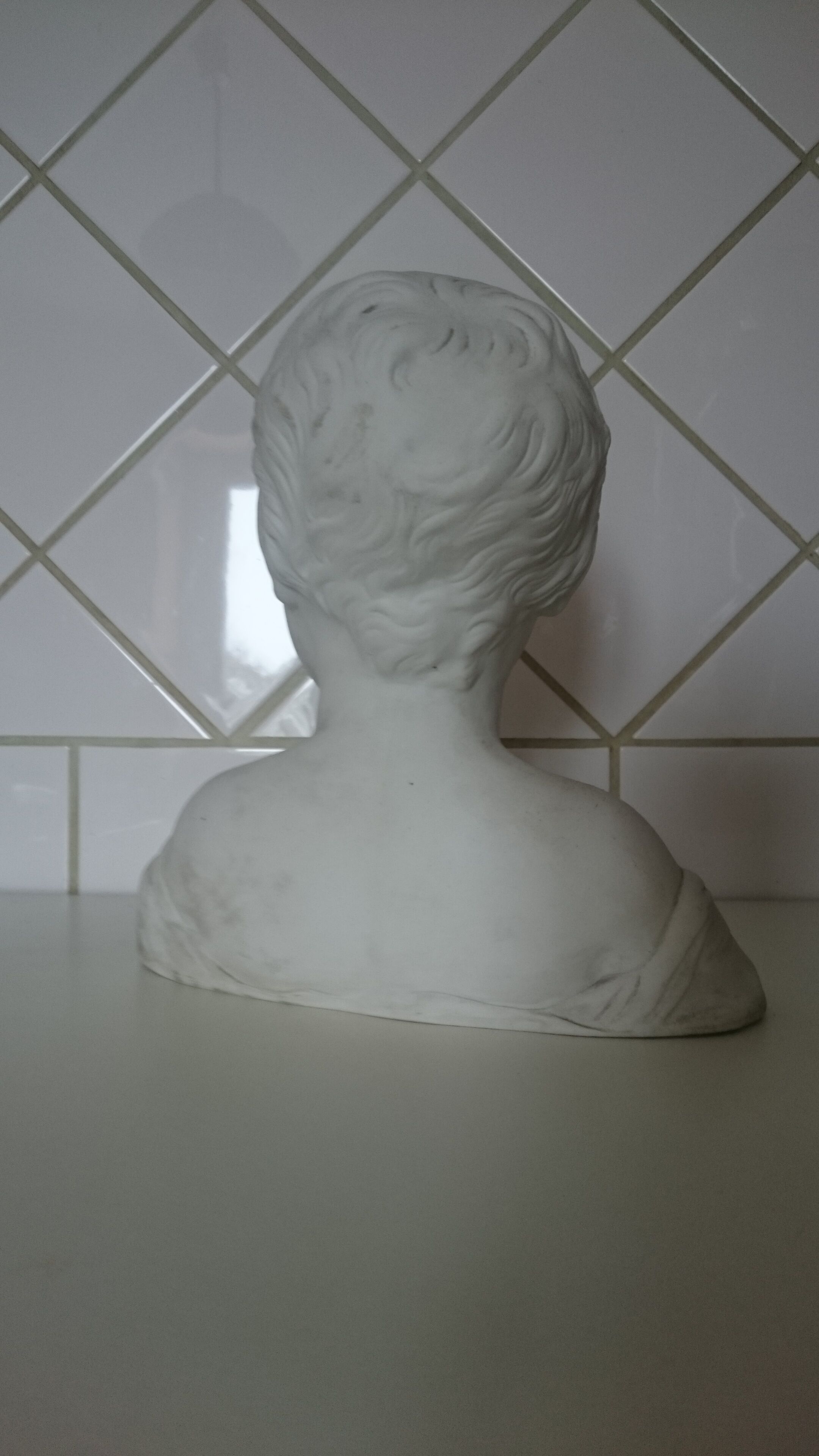 Laughing child bust after Donatello in Sèvres biscuit