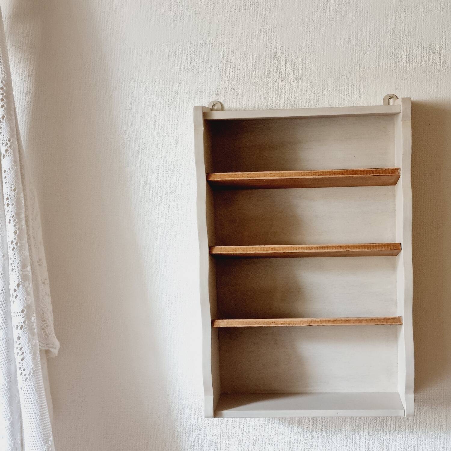 Linen-colored wooden shelf