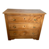 Rustic English pine chest of drawers with porcelain knobs.