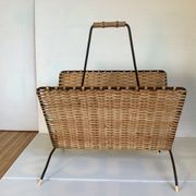 Old magazine rack in straw and black metal