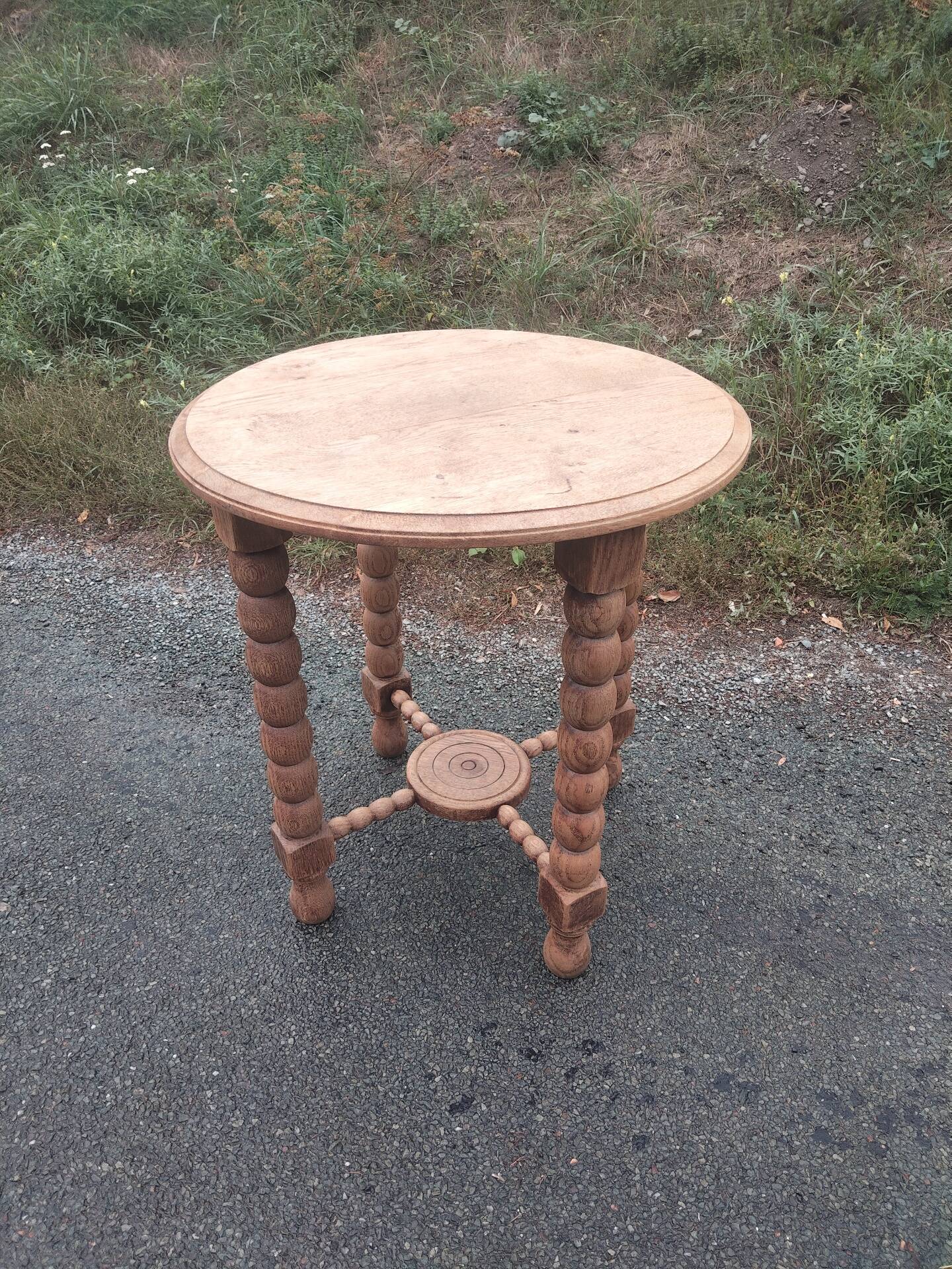 Oak gueridon in the style of Charles Dudouyt, 1940-50.
