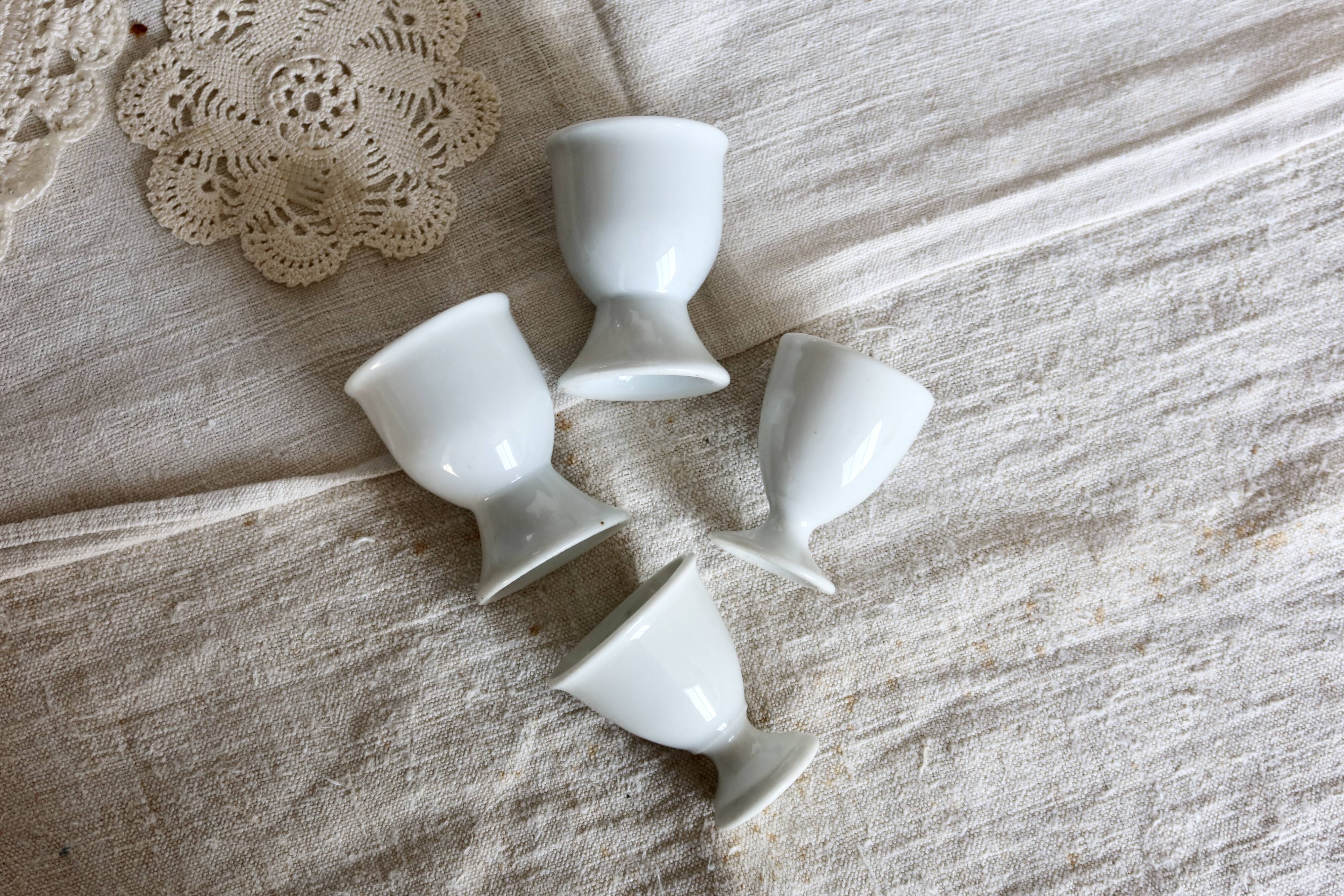 4 mismatched vintage white porcelain egg cups