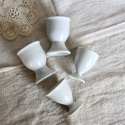 4 mismatched vintage white porcelain egg cups
