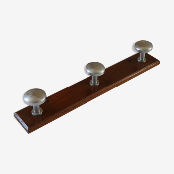 Wooden and stainless steel coat holders from the 1920s