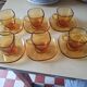 Service of 6 cups and saucers in amber glass.