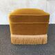 Gold velvet pouf with fringes