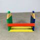 Wall-mounted pencil shelf for children, Pierre Sala style.