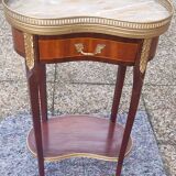 Louis XVI period pedestal table, in solid mahogany and veneer, and in gilded bronze.