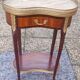 Louis XVI period pedestal table, in solid mahogany and veneer, and in gilded bronze.
