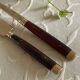 Service cutlery, brass and rosewood.