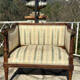 Low armchair in finely carved wood in the Louis XVI style from the 19th century