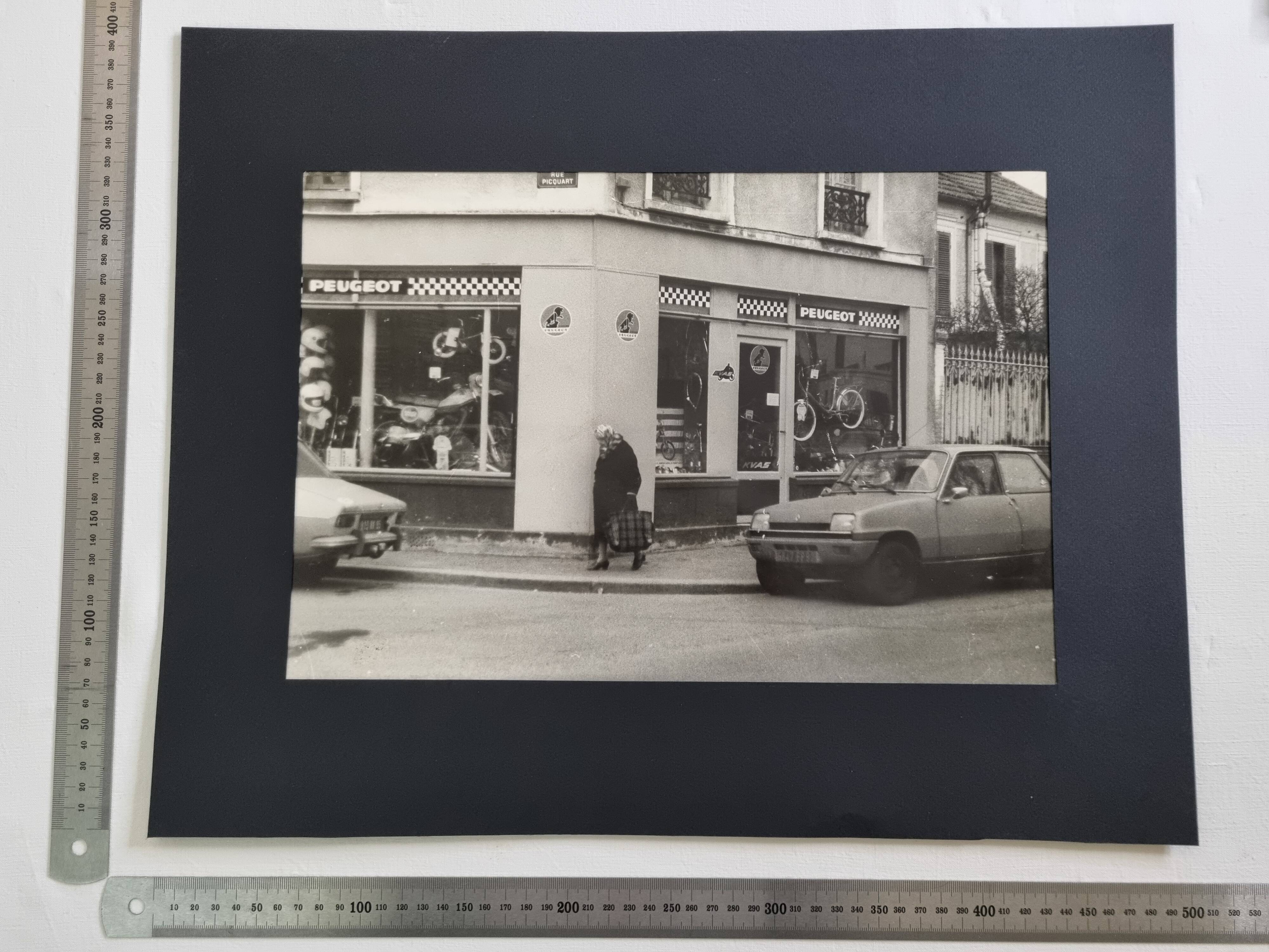 Vintage silver gelatin print of a street scene in a shop window, 1970s, framed, 52 x 42 cm