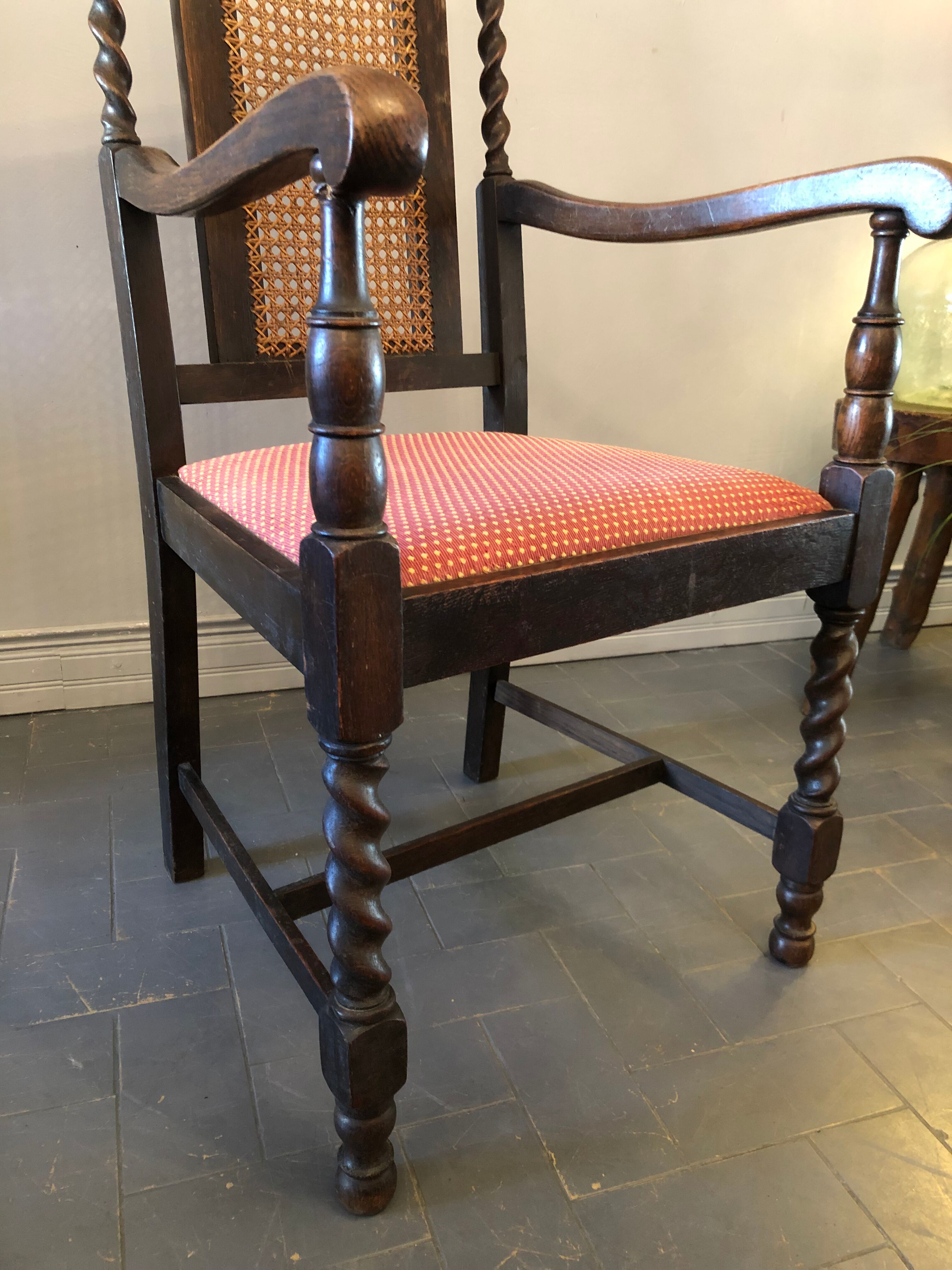 Carved wooden armchair and cannage