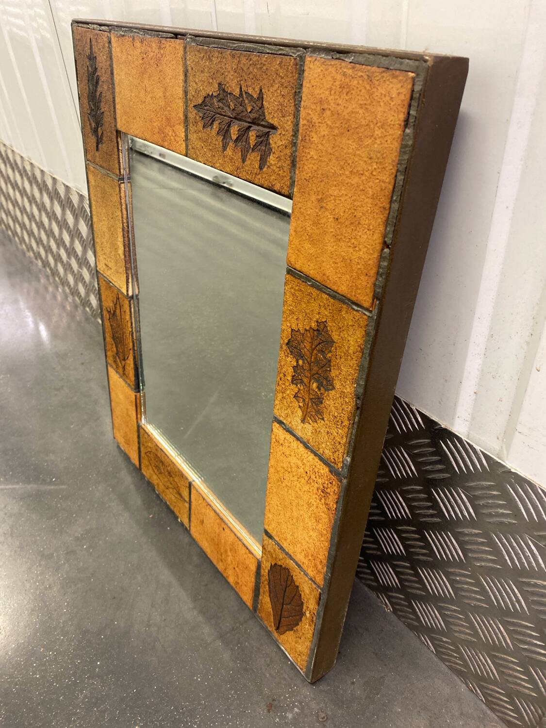 Ceramic wall mirror with herbarium decor circa 1960