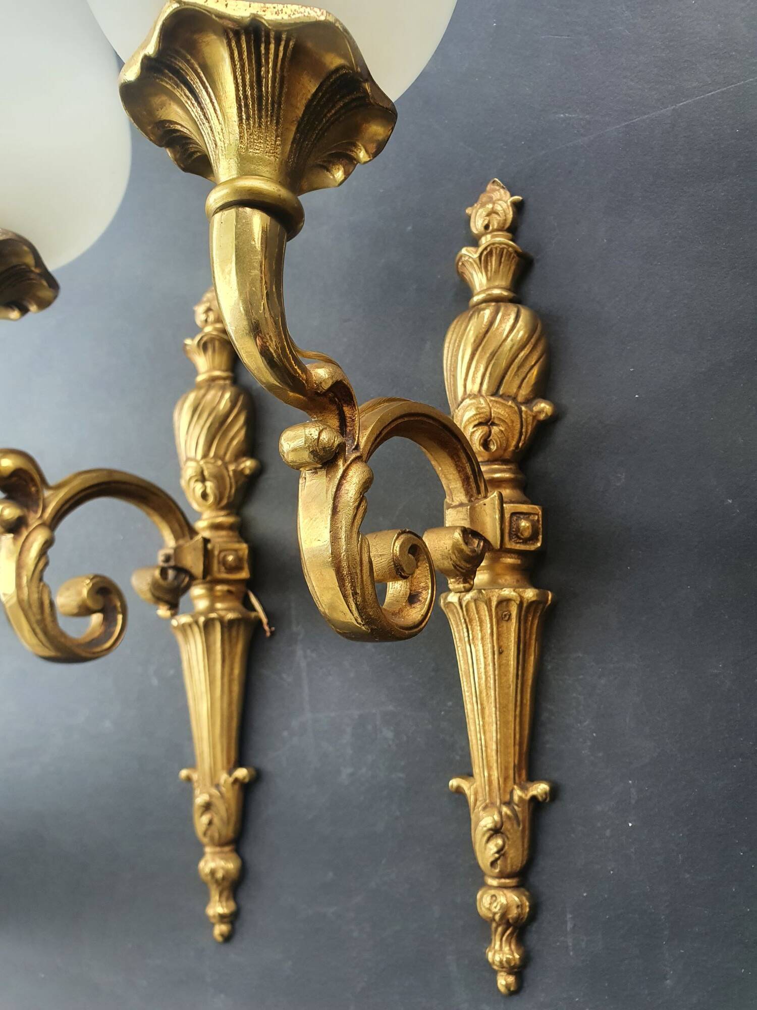 Three large vintage torch wall sconces.