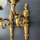 Three large vintage torch wall sconces.