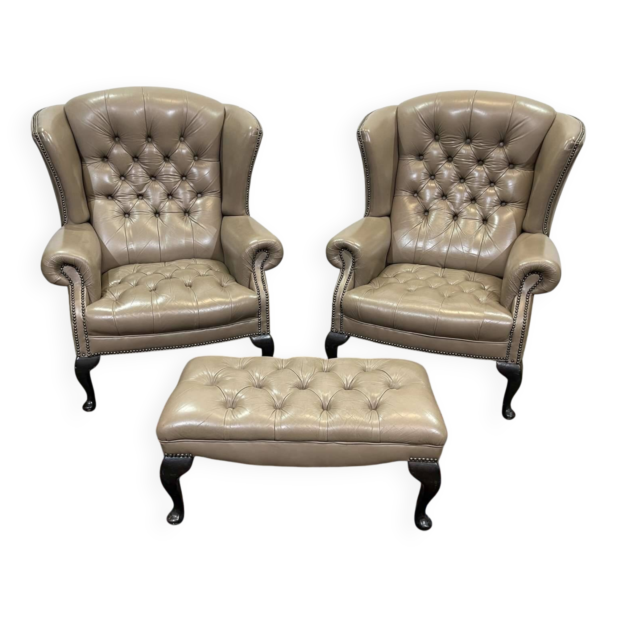 Pair of high-backed Chesterfield armchairs with 1 leather footrest