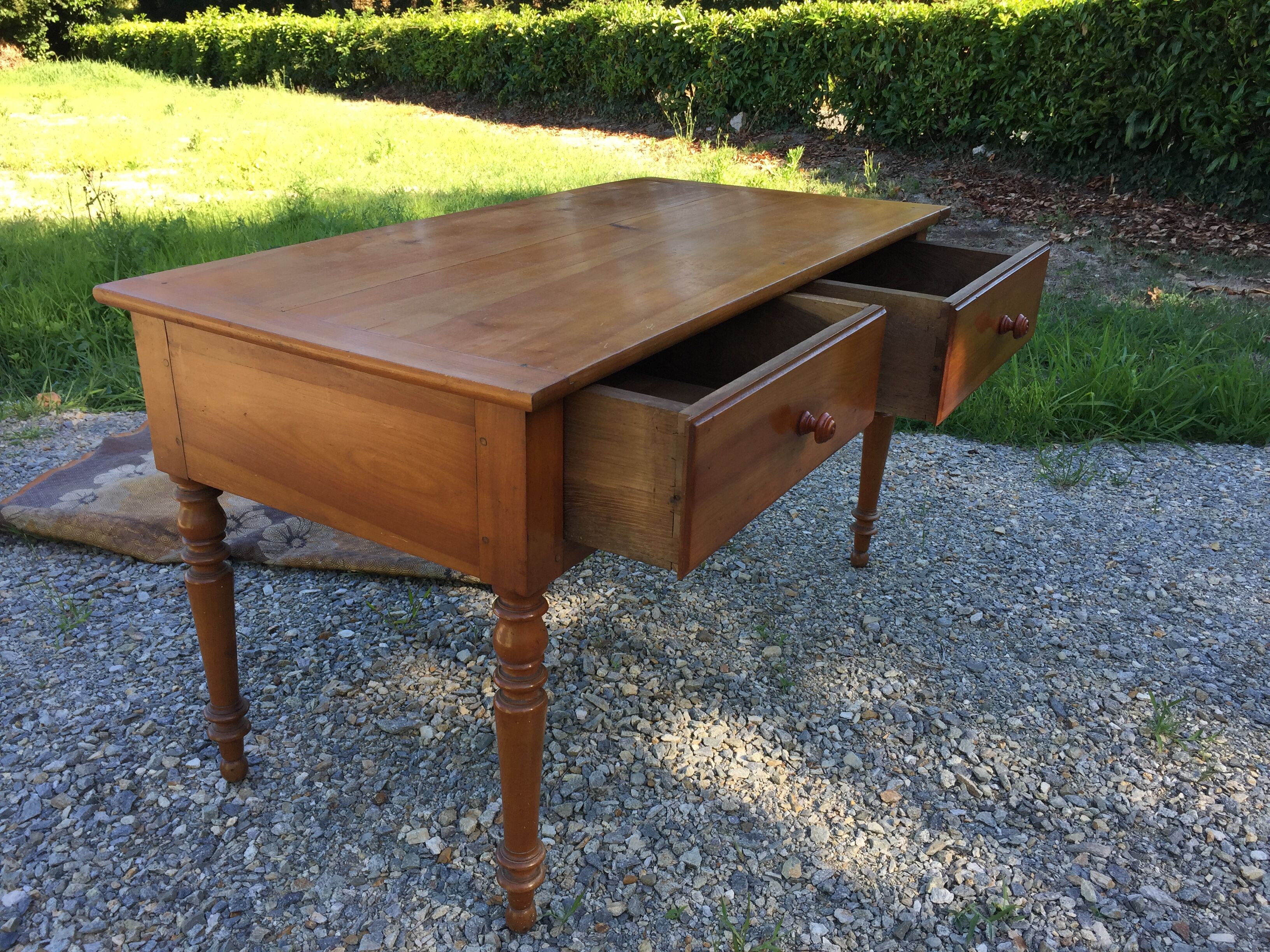 Old farmhouse table louis Philippe style in solid cherry with turned feet.