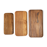 Trio of rounded rectangular trays or cups in monoxyl teak L:35