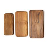 Trio of rounded rectangular trays or cups in monoxyl teak L:35