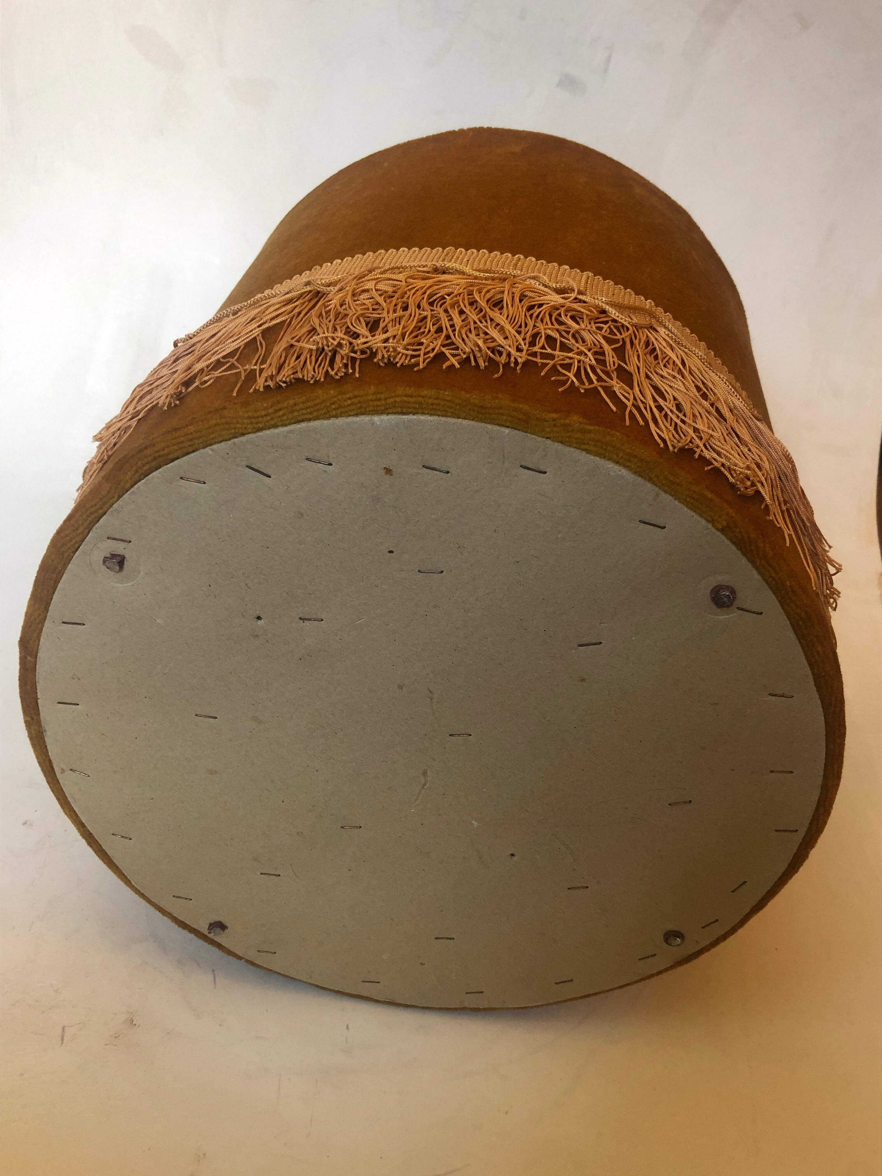 Velvet and fringed ottoman