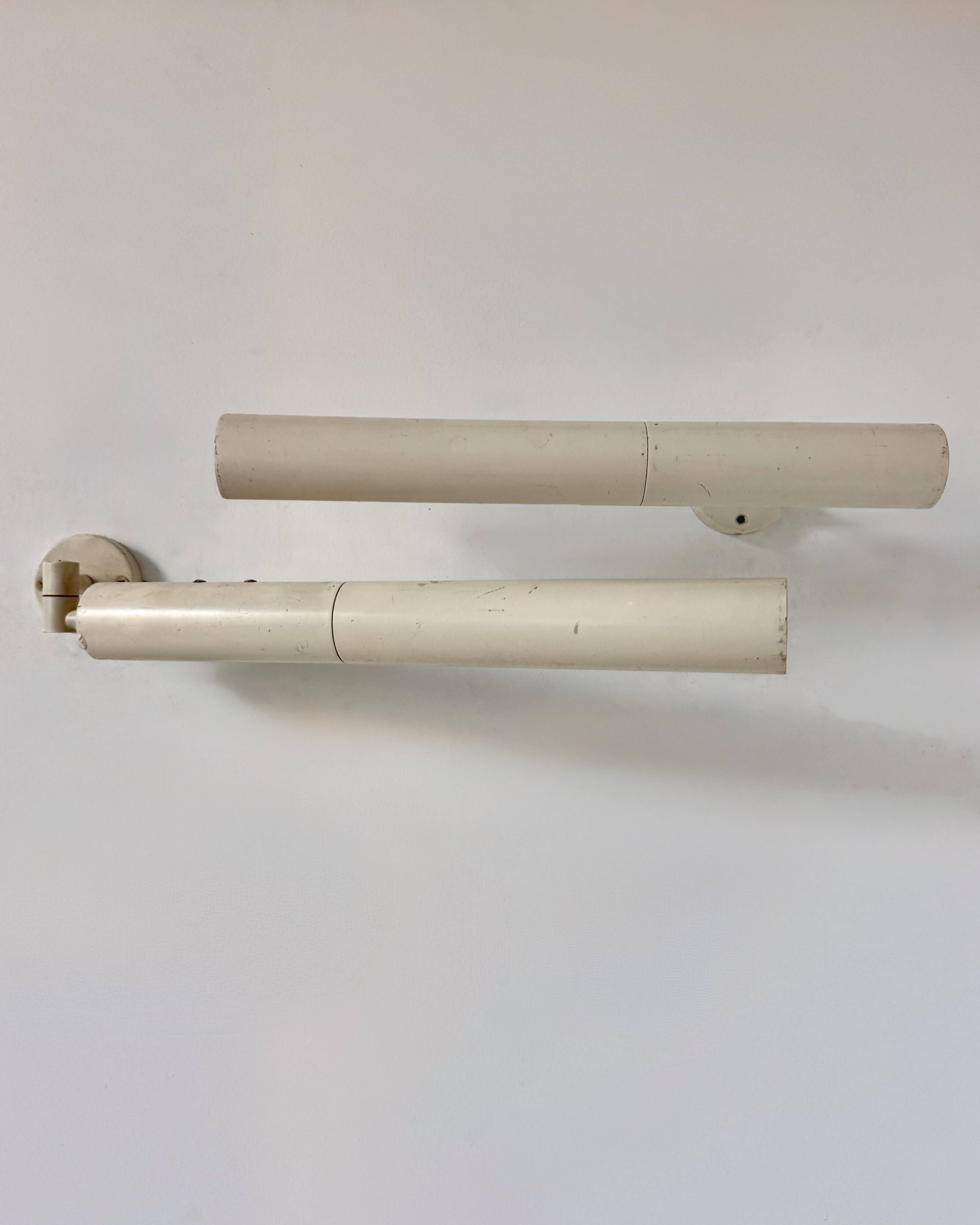Pair of vintage matte white metal wall lights, France 1970.