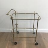 Neoclassical brass rolling table with double glass tops