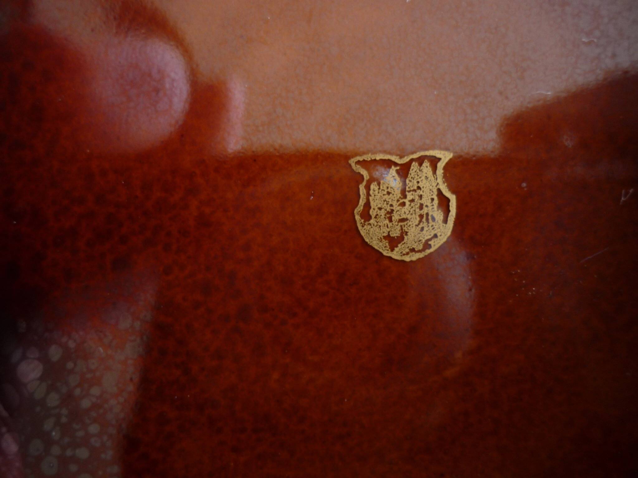 Square dish with brown and gold handles