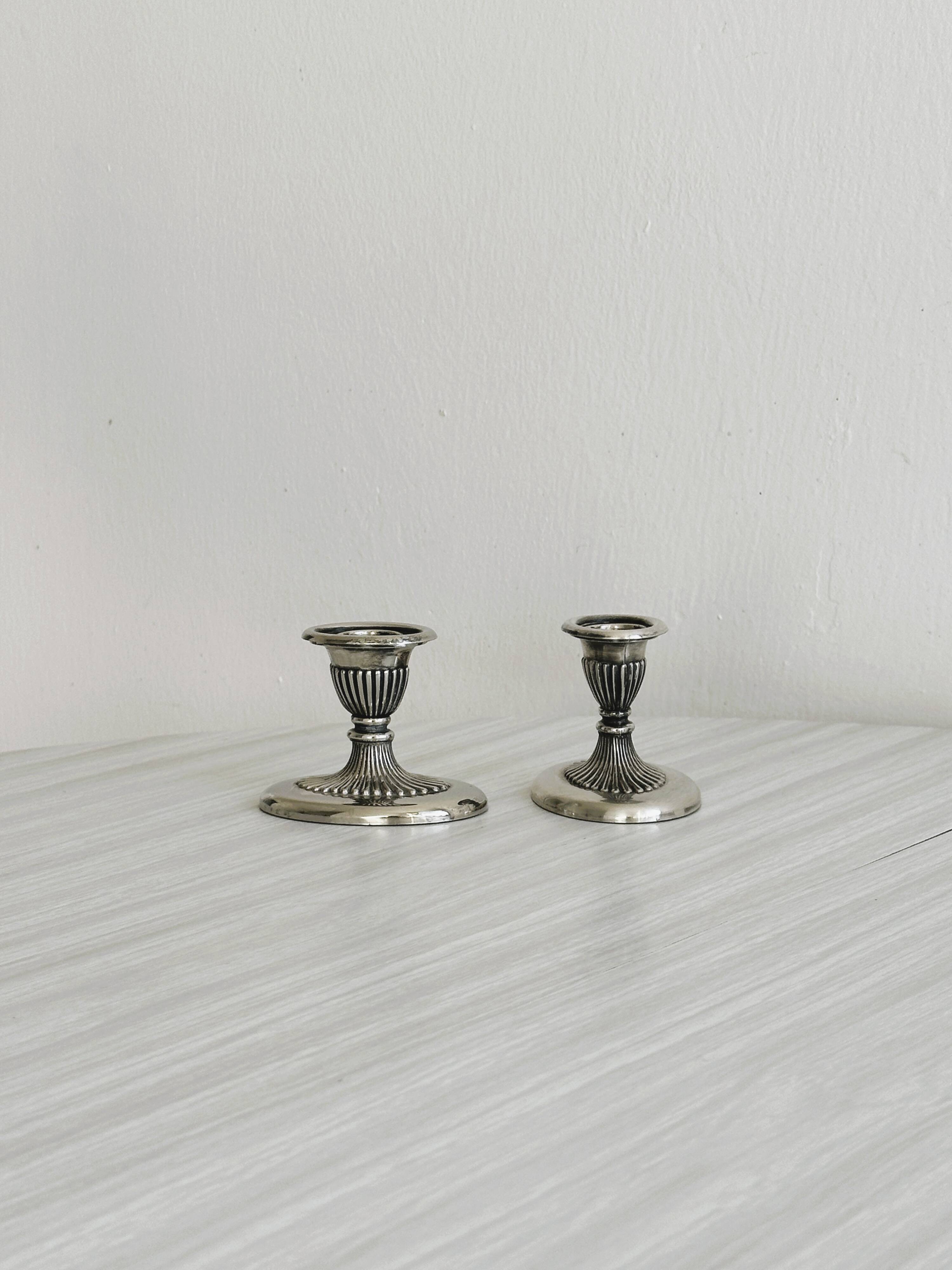 Pair of antique metal candlesticks