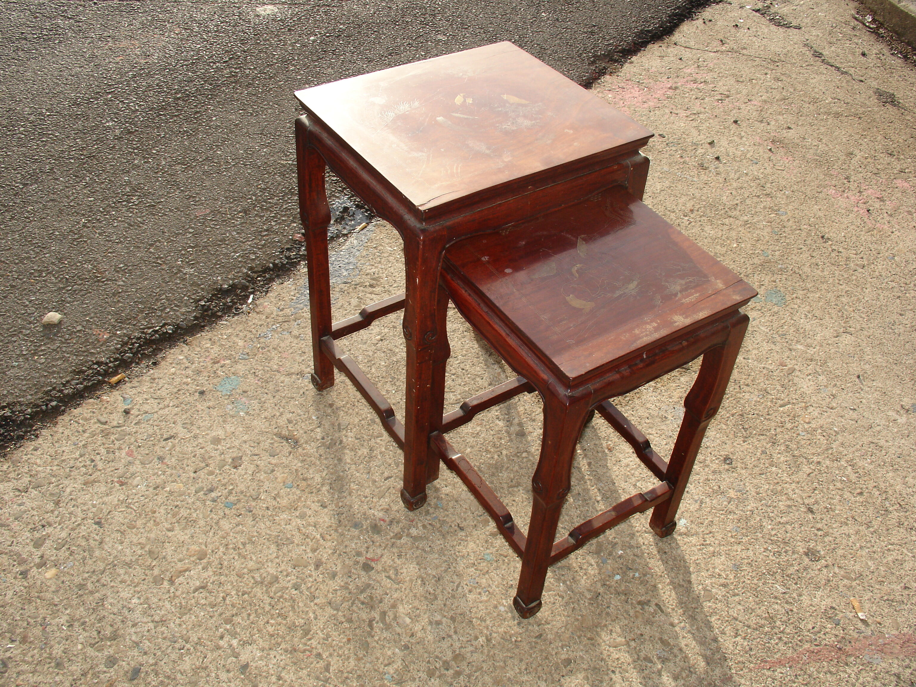 Nesting tables in ironwood with engraved decoration and gold highlights